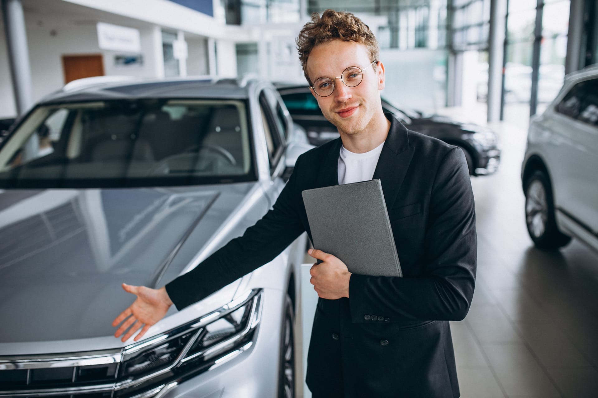 Salesman at a car showroom