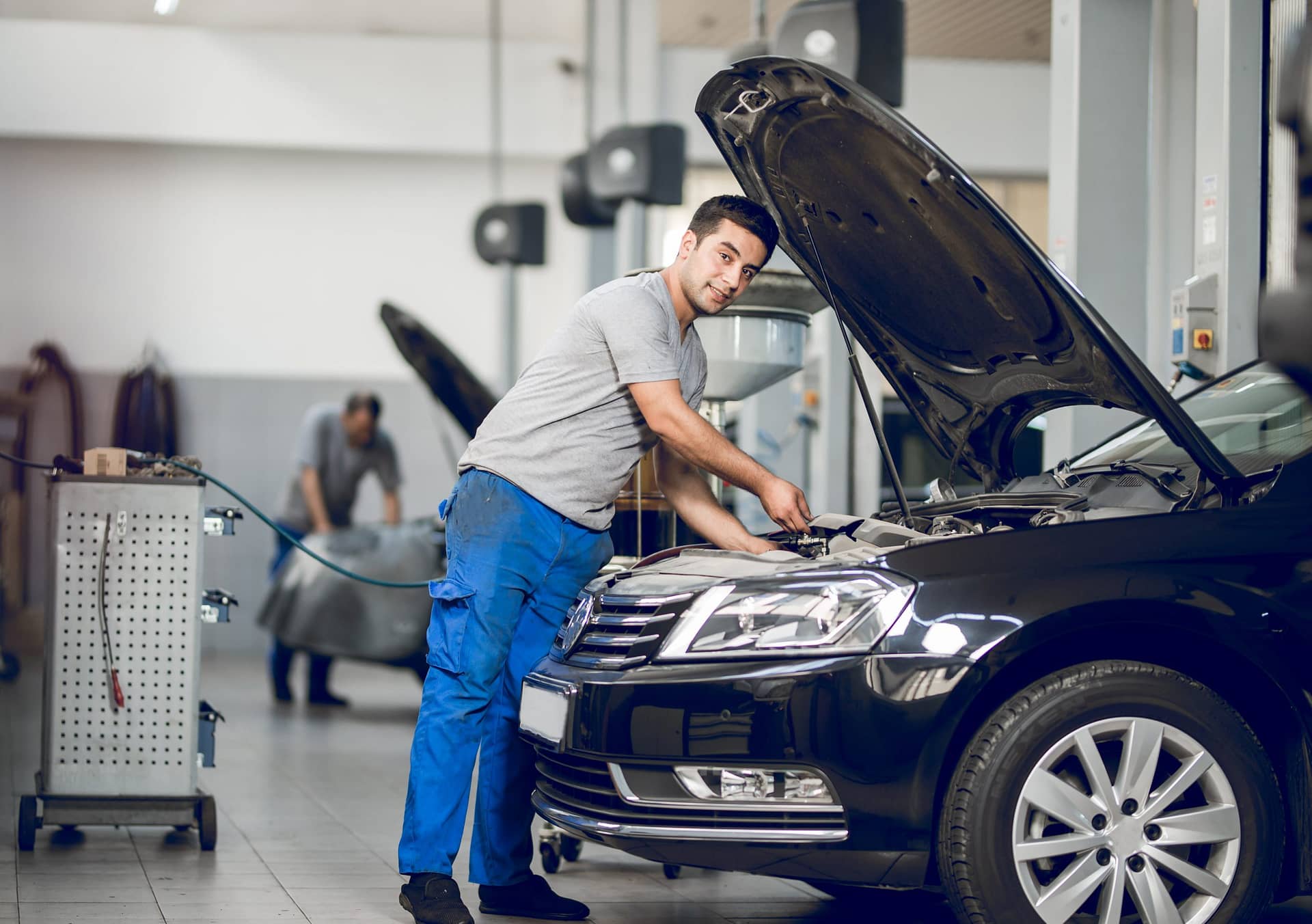 a-benchman-fixing-the-engine-of-a-car